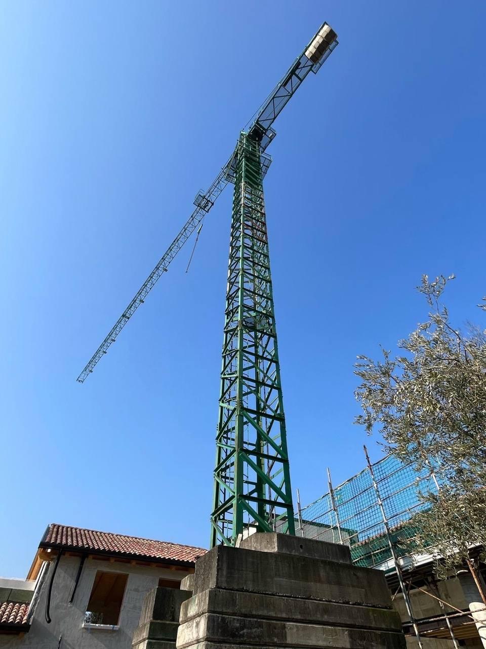 Tower crane with Mediterranean building in background